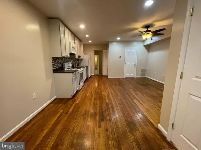a view of a kitchen with a sink and dishwasher