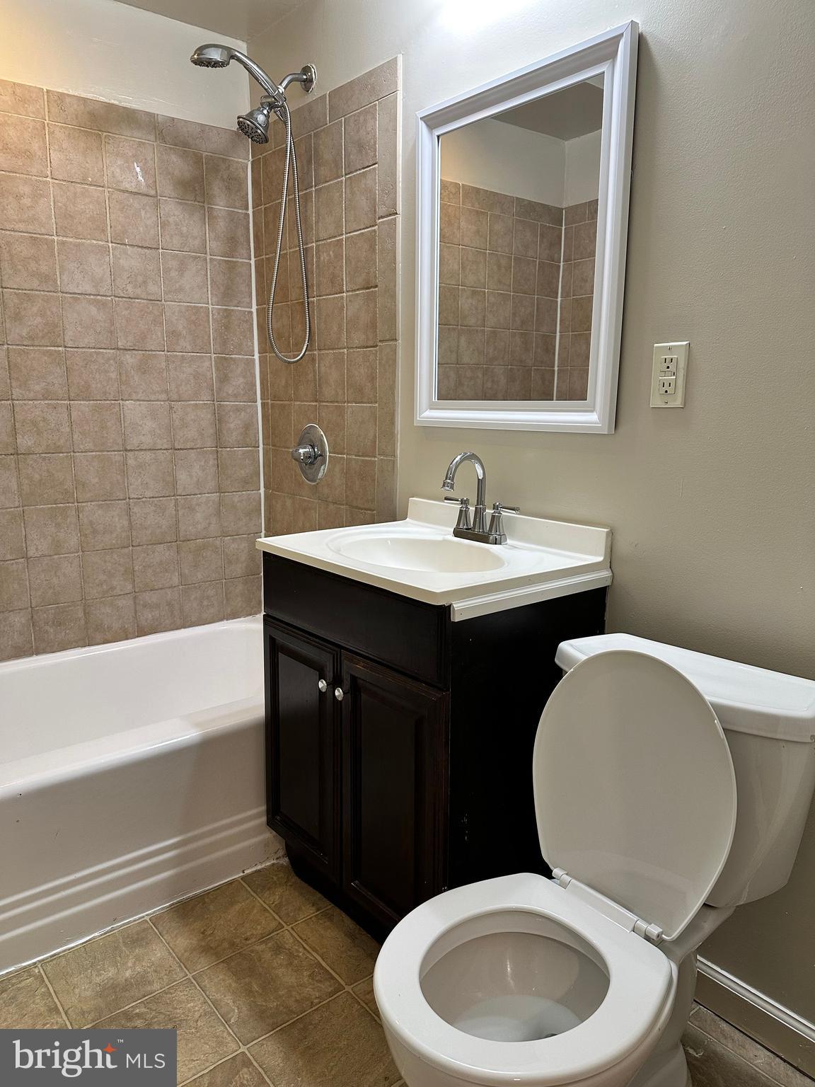1913 Rosedale Street Northeast, Unit 1 Washington, DC 20002 - Photo 22 of 31 a bathroom with a toilet a sink and bathtub