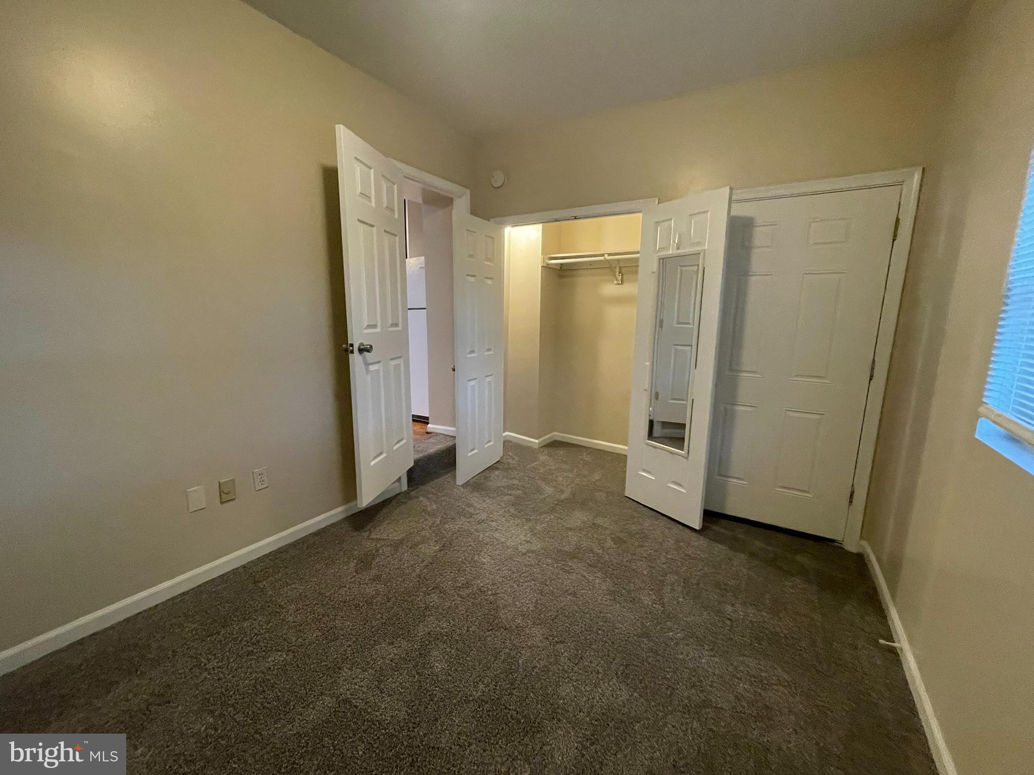 1913 Rosedale Street Northeast, Unit 1 Washington, DC 20002 - Photo 27 of 31 an empty room with closet