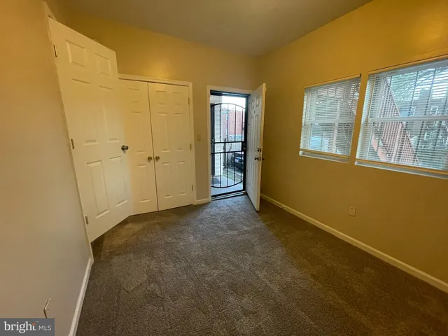 a view of an empty room with windows