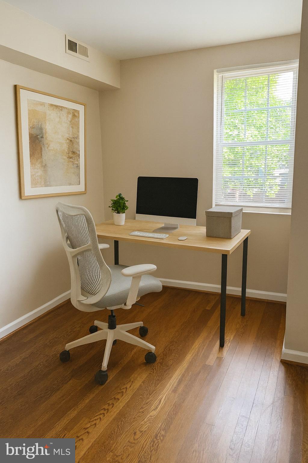 1913 Rosedale Street Northeast, Unit 1 Washington, DC 20002 - Photo 5 of 31 a view of a workspace with wooden floor and a window