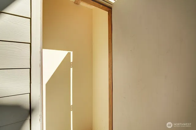 a view of a hallway with closet