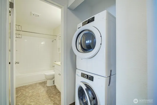 a view of a bathroom with a washer and dryer