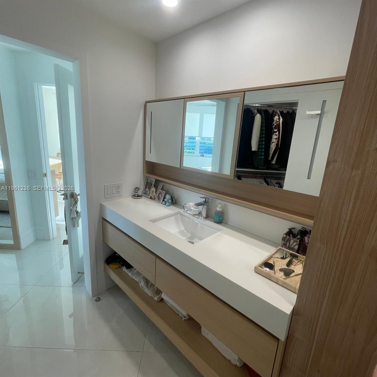 888 Brickell Key Drive, Unit 802 Miami, FL 33131 - Photo 12 of 16 a bathroom with a sink double vanity and a mirror