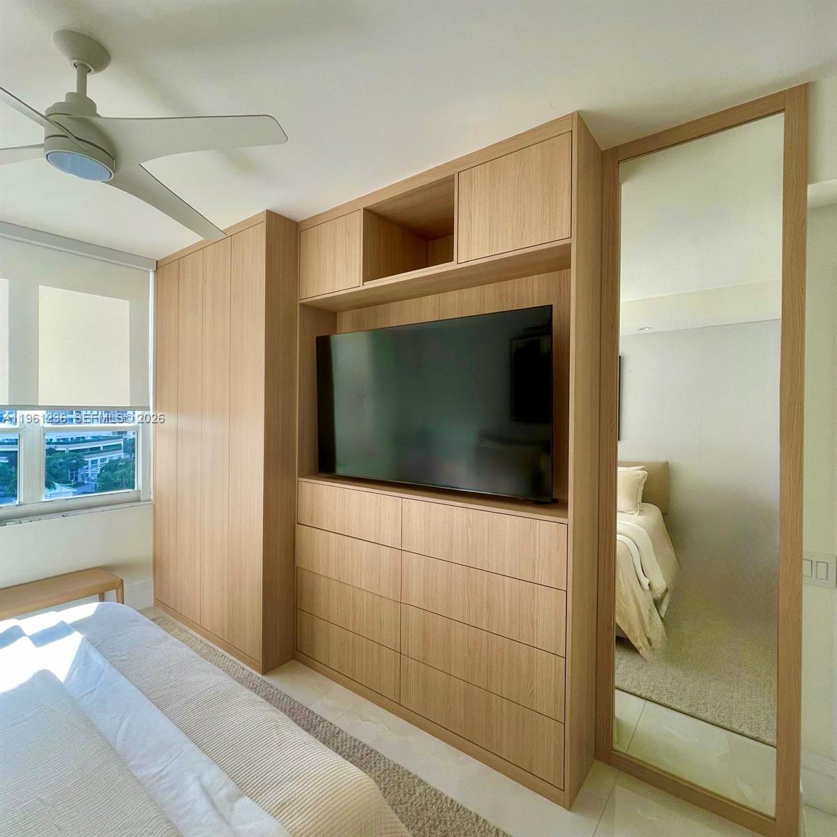 888 Brickell Key Drive, Unit 802 Miami, FL 33131 - Photo 7 of 16 a bathroom with a shower and a bathtub