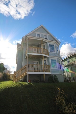 74 Green Hill Parkway Worcester, MA 01605 - Photo 1 of 42 a front view of a house with a garden