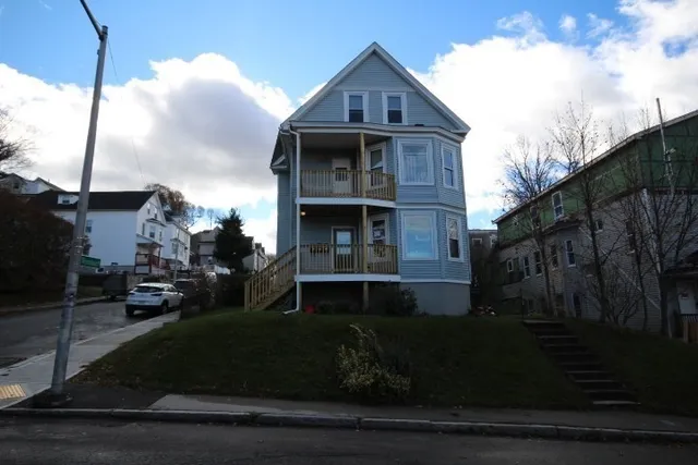 a front view of a house with a yard