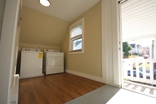 a view of a balcony with wooden floor