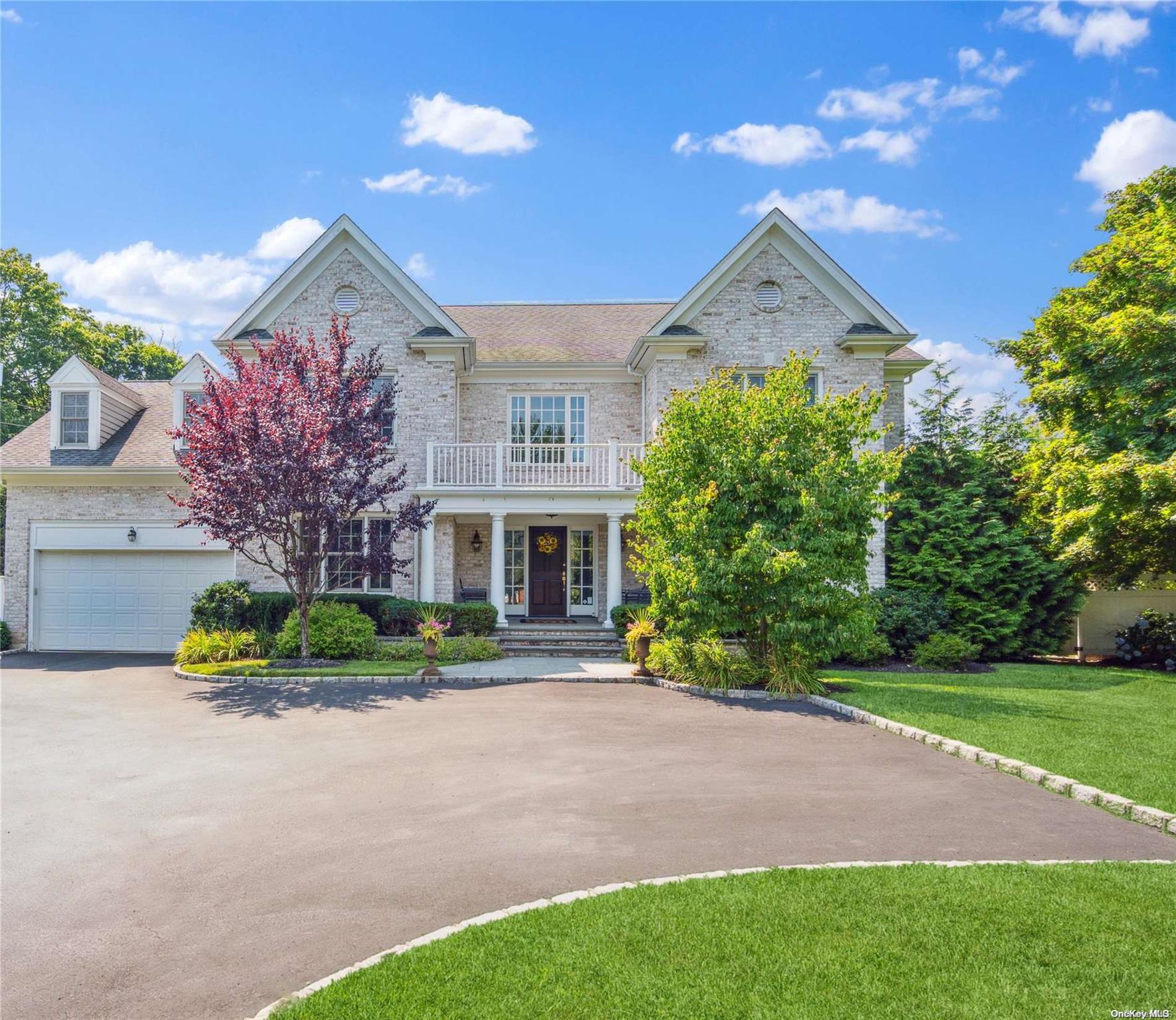 29 Red Spring Lane Glen Cove, NY 11542 - Photo 1 of 1 a front view of a house with a yard and garage
