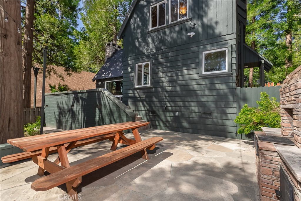 148 Bret Harte Road Lake Arrowhead, CA 92352 - Photo 13 of 23 a view of a bench in a backyard