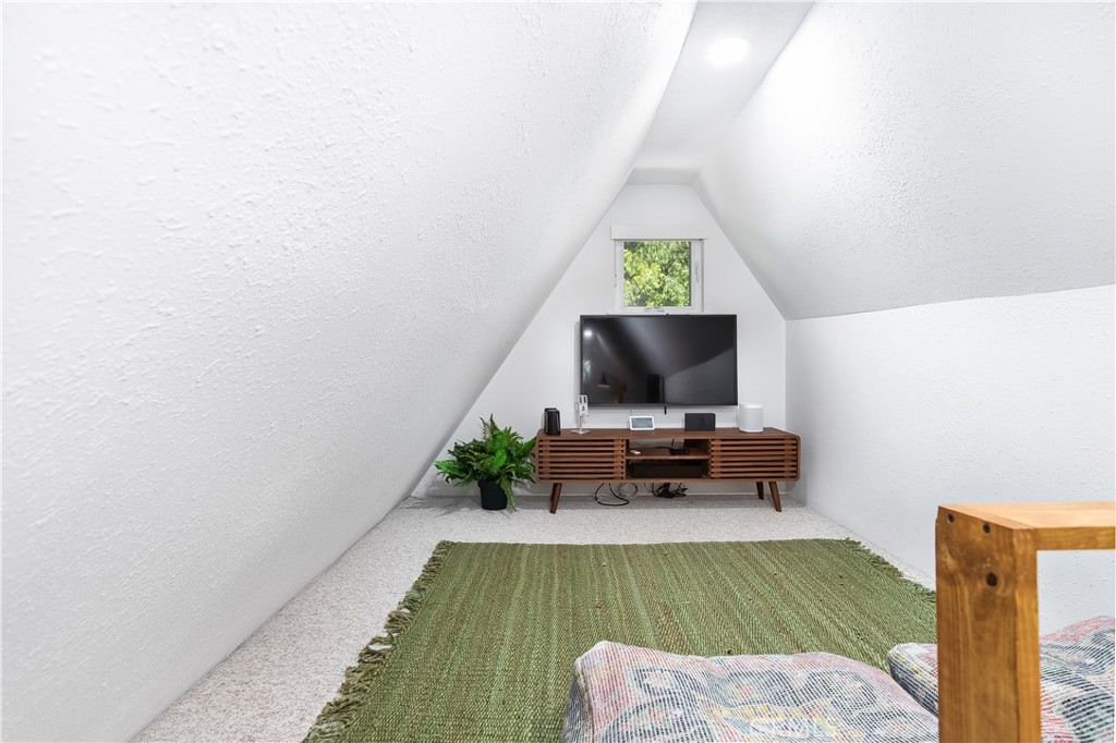 148 Bret Harte Road Lake Arrowhead, CA 92352 - Photo 16 of 23 a living room with furniture and a flat screen tv