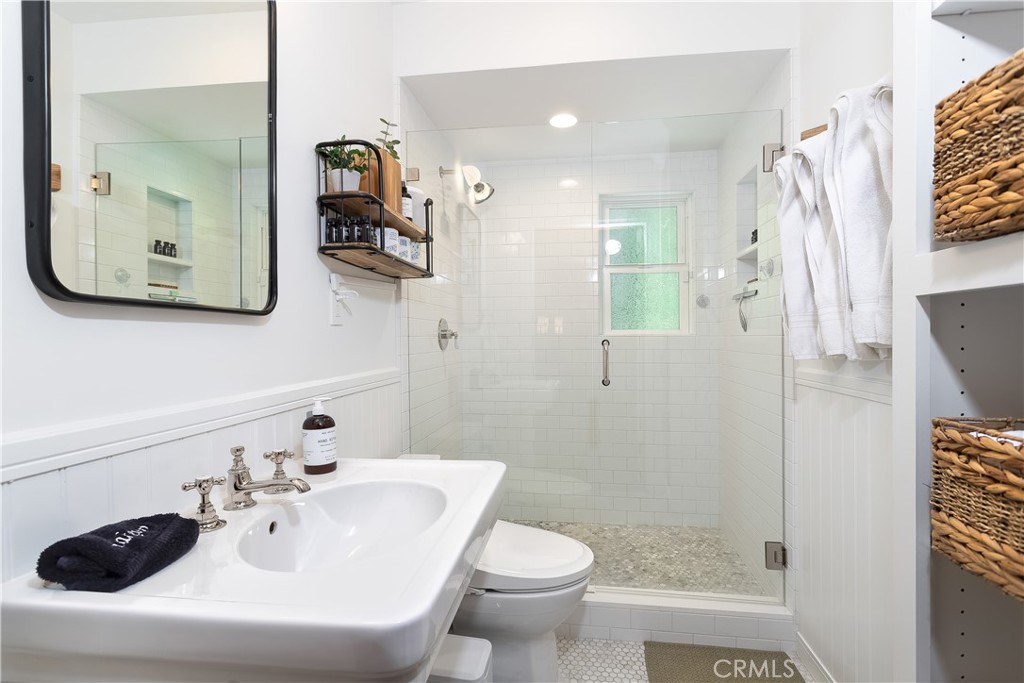 148 Bret Harte Road Lake Arrowhead, CA 92352 - Photo 18 of 23 a bathroom with a sink a toilet and shower