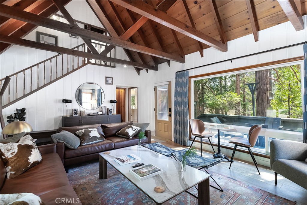 148 Bret Harte Road Lake Arrowhead, CA 92352 - Photo 4 of 23 a living room with furniture and a large window