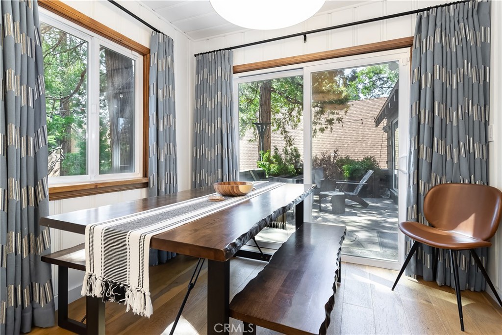 148 Bret Harte Road Lake Arrowhead, CA 92352 - Photo 9 of 23 a dining room with furniture and a window
