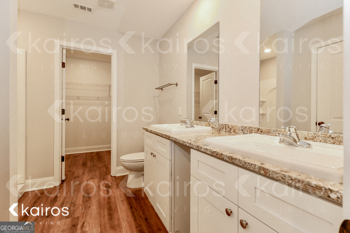 153 Cottage Grove Road Brunswick, GA 31525 - Photo 10 of 16 a bathroom with a granite countertop sink toilet and shower