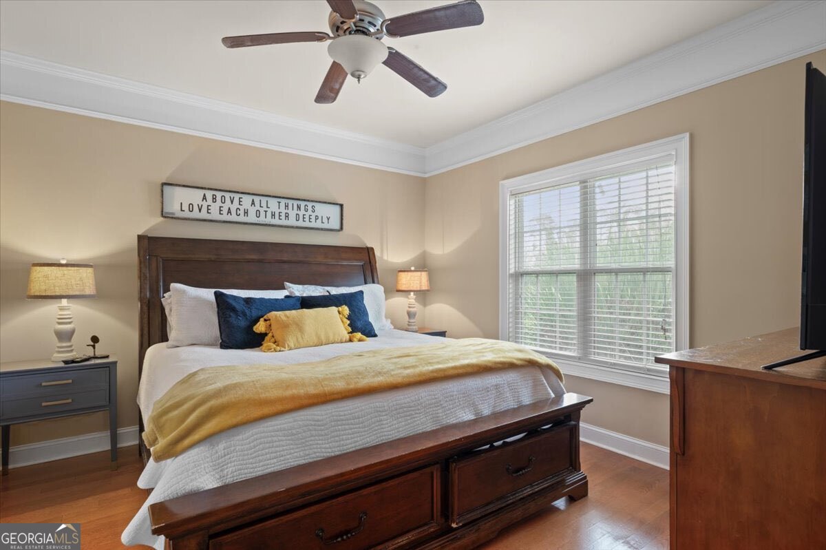 7272 Shellman Bluff Road Northeast, Unit 21 Townsend, GA 31331 - Photo 14 of 34 a bedroom with a bed and a window