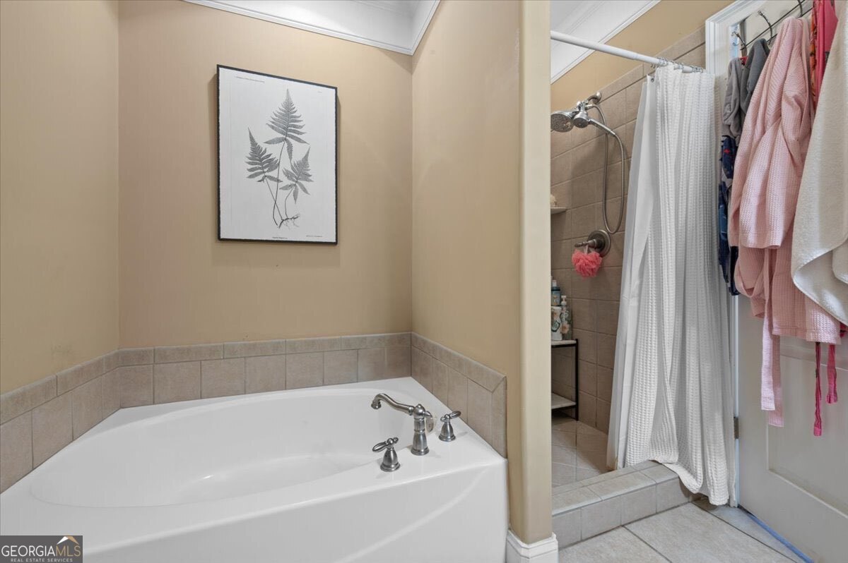 7272 Shellman Bluff Road Northeast, Unit 21 Townsend, GA 31331 - Photo 17 of 34 a bathroom with a bathtub and a shower