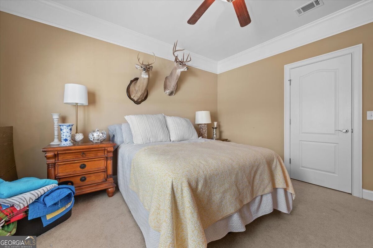 7272 Shellman Bluff Road Northeast, Unit 21 Townsend, GA 31331 - Photo 21 of 34 a bedroom with a bed and closet