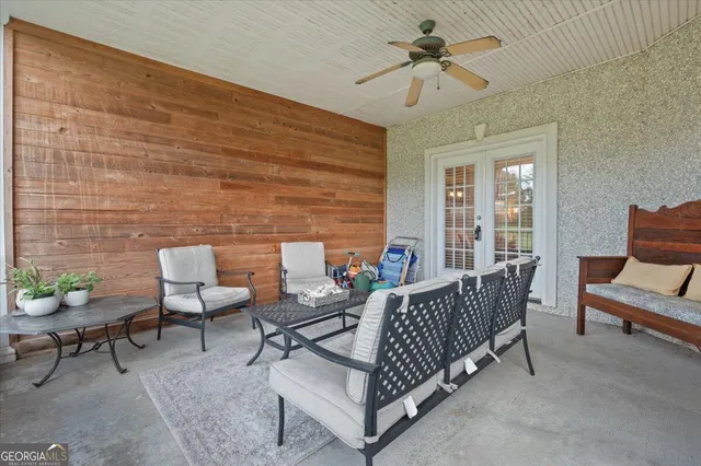 a front view of a building with a garden