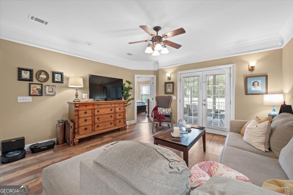 7272 Shellman Bluff Road Northeast, Unit 21 Townsend, GA 31331 - Photo 3 of 34 a living room with furniture and a flat screen tv