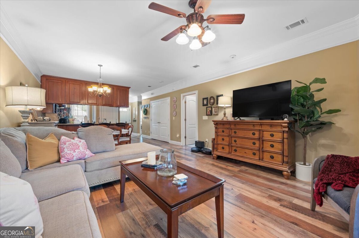 7272 Shellman Bluff Road Northeast, Unit 21 Townsend, GA 31331 - Photo 5 of 34 a living room with furniture and a flat screen tv