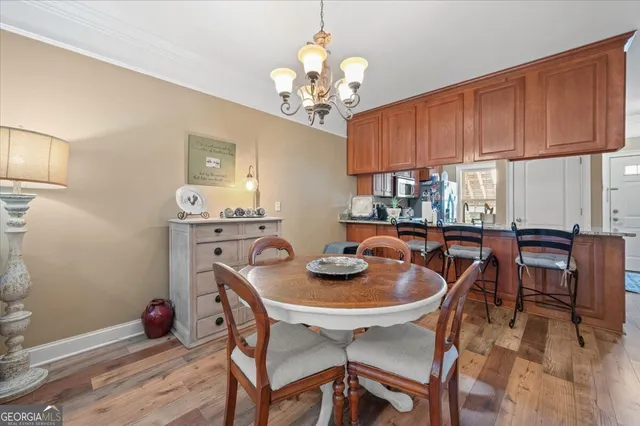 a kitchen with granite countertop a sink and cabinets