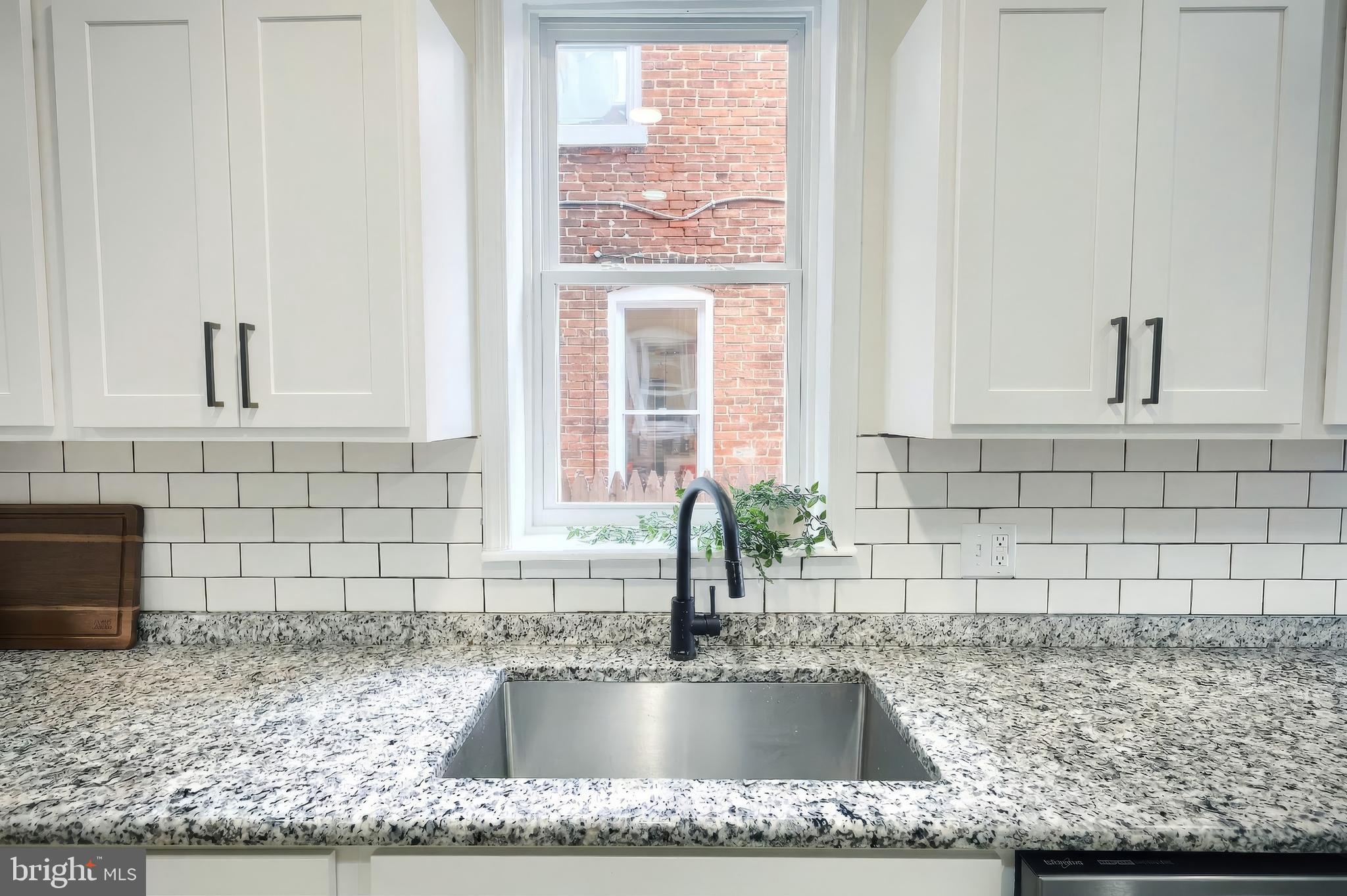442 East Prospect Street York, PA 17403 - Photo 11 of 33 a kitchen with granite countertop a sink and a window