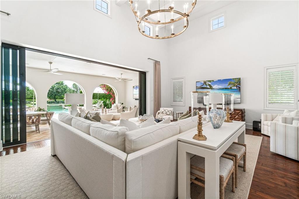 16755 Lucarno Way Naples, FL 34110 - Photo 2 of 50 a living room with furniture and a large window