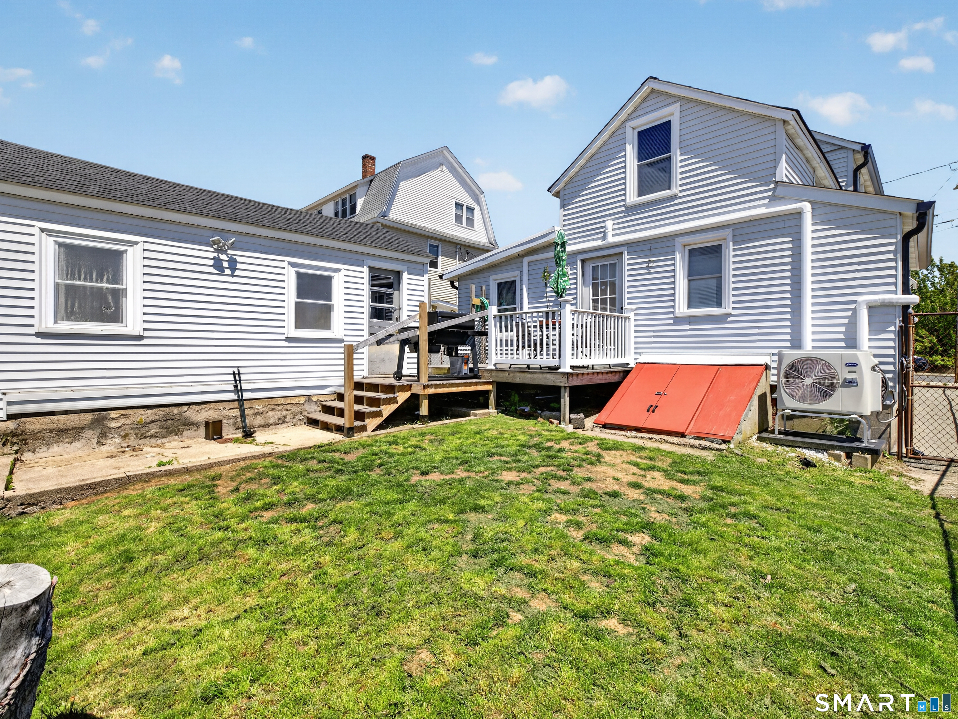 13 Oak Street Groton, CT 06340 - Photo 31 of 38 a backyard of a house with barbeque oven table and chairs