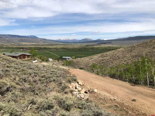 an aerial view of houses with yard