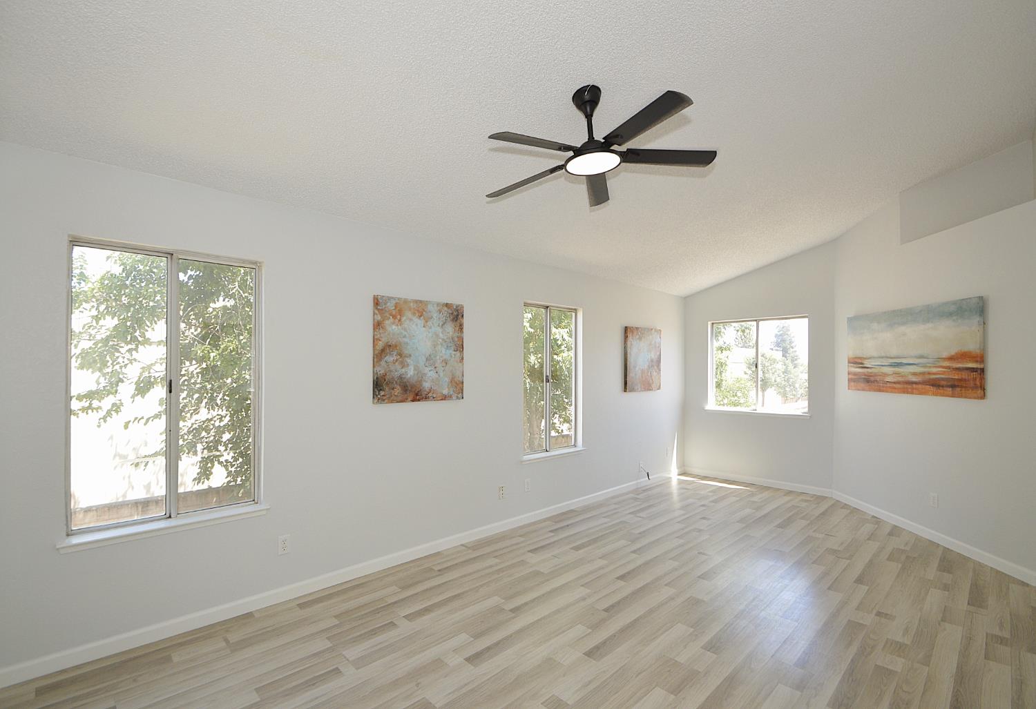 3290 North Rafael Avenue Fresno, CA 93722 - Photo 28 of 34 Master bedroom has laminate flooring.
