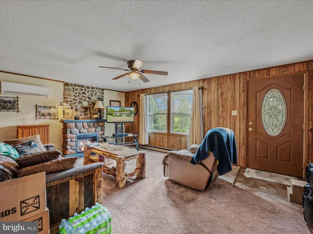 a living room with furniture a table and chairs