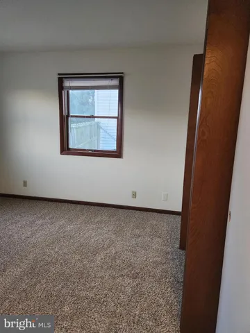 a view of a window in an empty room