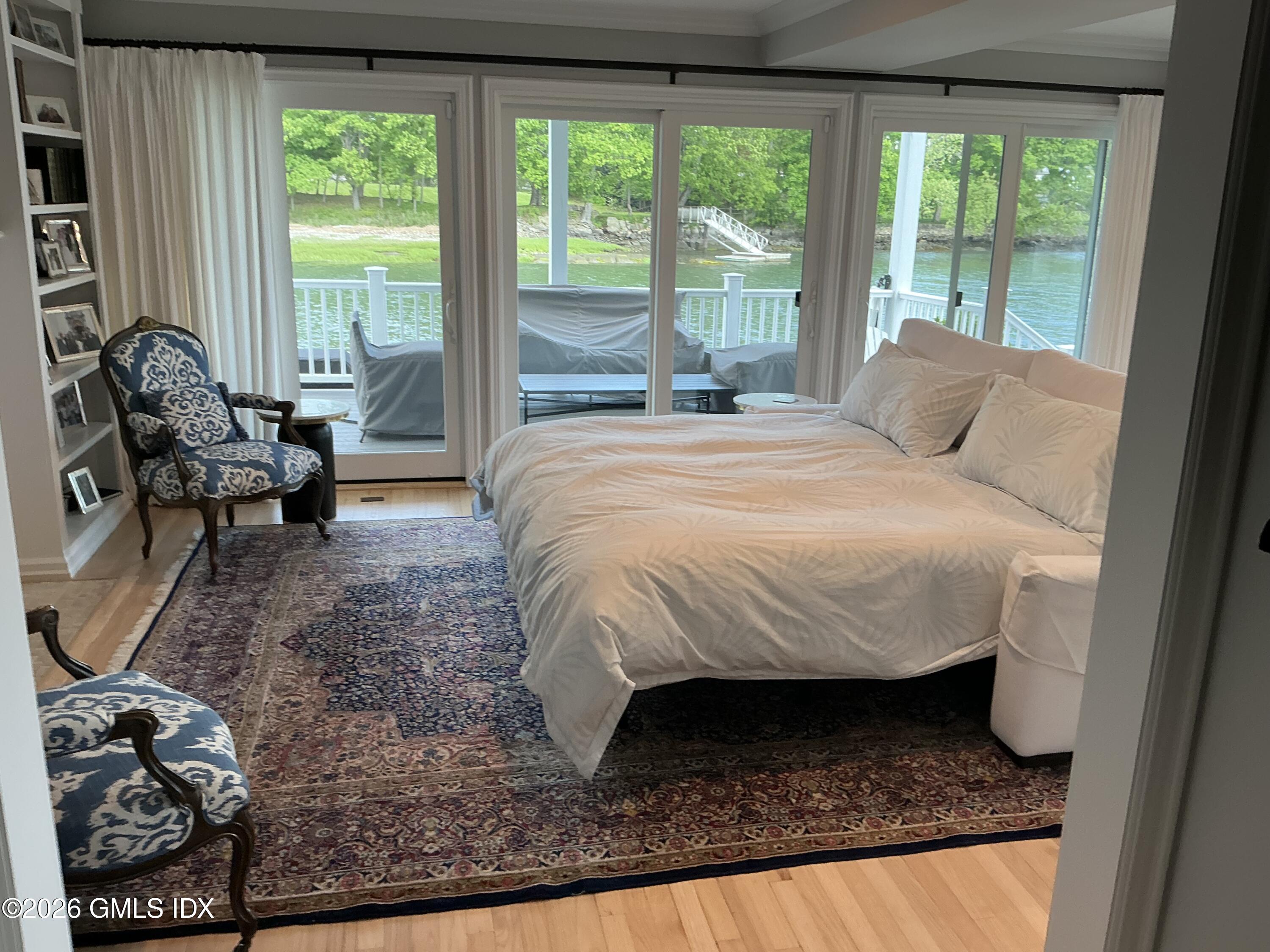 633 Steamboat Road, Unit 5 Greenwich, CT 06830 - Photo 3 of 29 a bed sitting in a bedroom next to a window