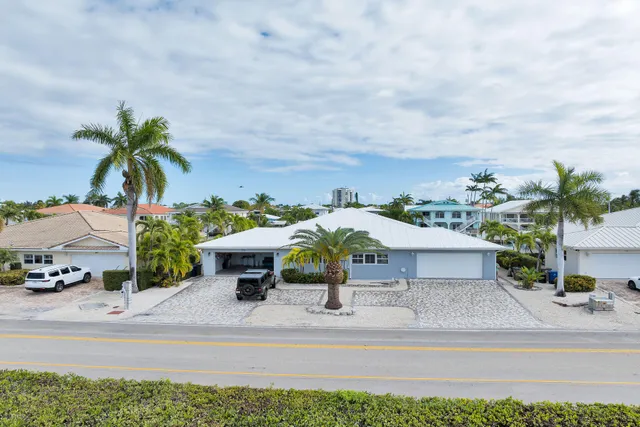 a view of a terrace with a bench and a garden