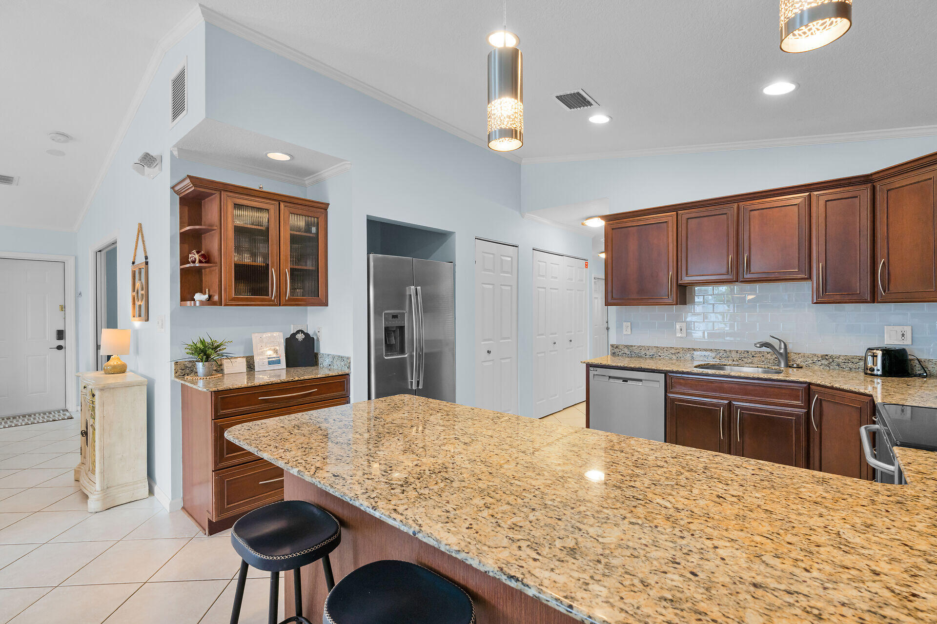 270 Sadowski Key Key Colony Beach, FL 33051 - Photo 9 of 46 a kitchen with stainless steel appliances granite countertop a stove top oven a sink dishwasher and cabinets with wooden floor