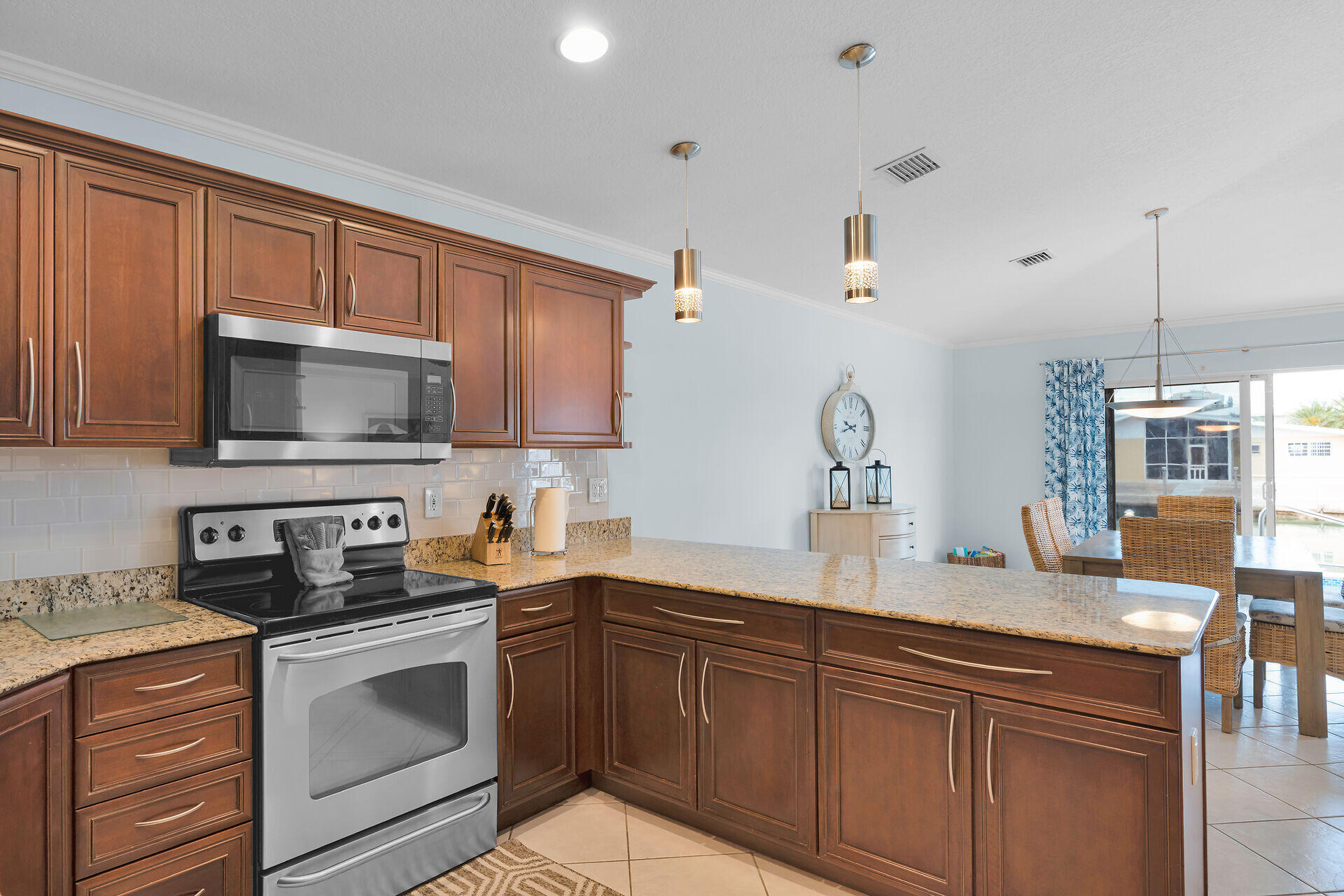 270 Sadowski Key Key Colony Beach, FL 33051 - Photo 11 of 46 a kitchen with granite countertop a sink stove and microwave
