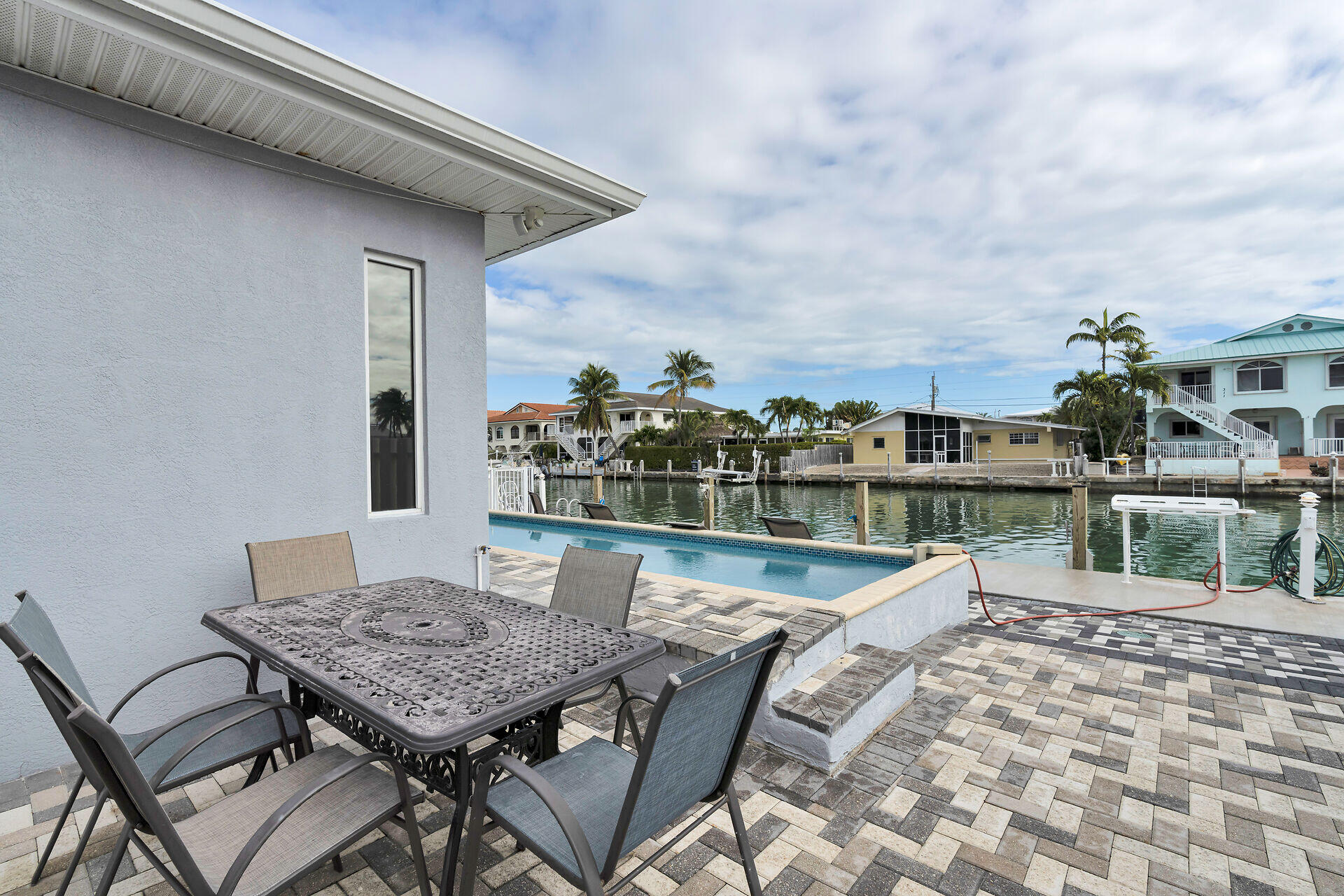 270 Sadowski Key Key Colony Beach, FL 33051 - Photo 34 of 46 a view of a roof deck with dining table and chair