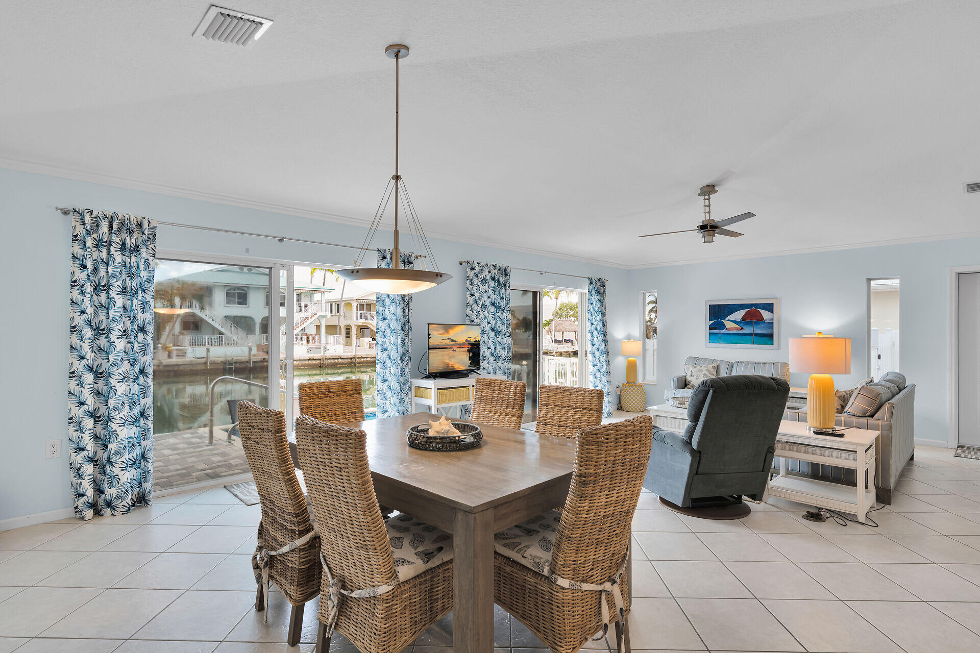 270 Sadowski Key Key Colony Beach, FL 33051 - Photo 44 of 46 a view of a dining room with furniture wooden floor and chandelier
