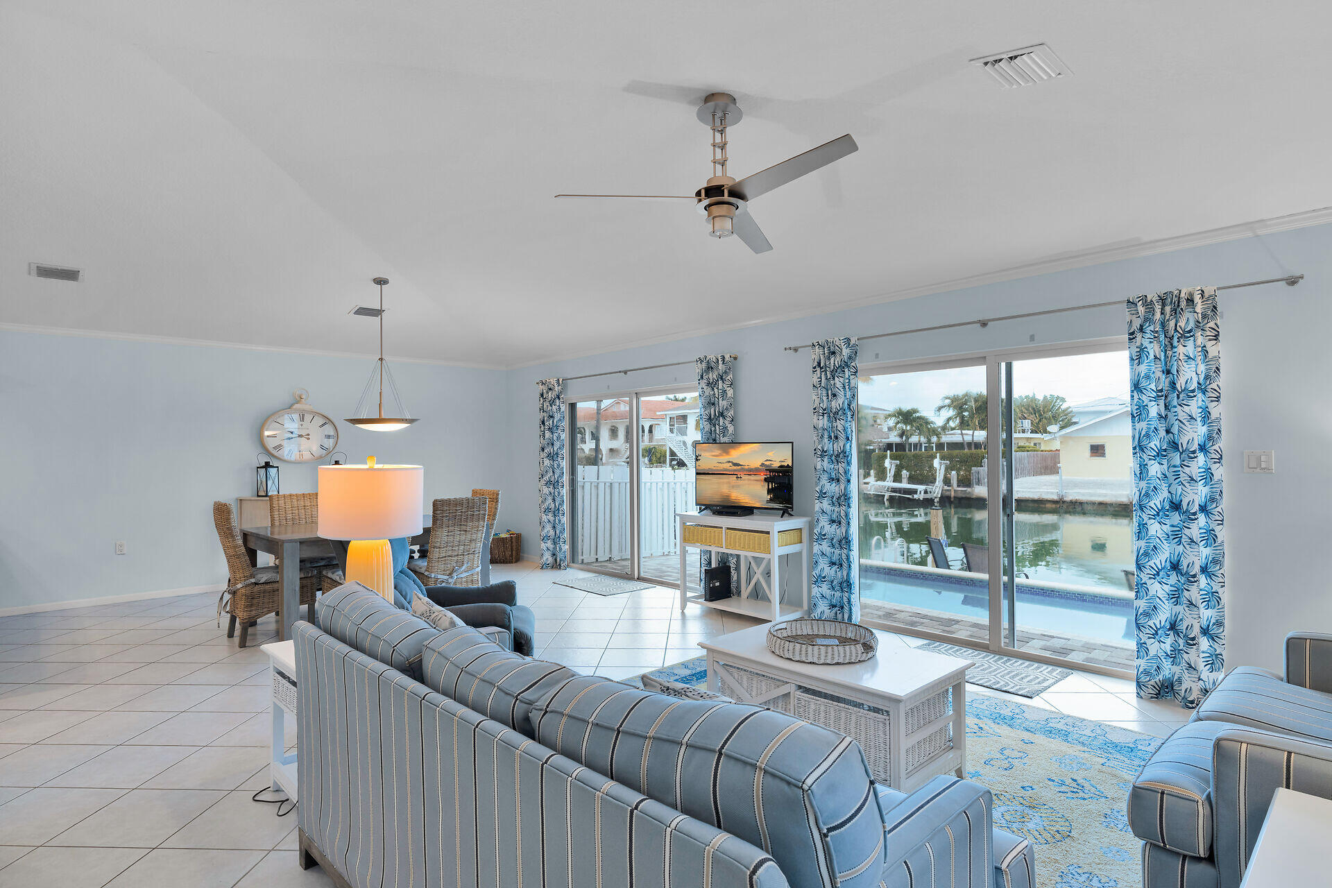 270 Sadowski Key Key Colony Beach, FL 33051 - Photo 5 of 46 a living room with furniture a fireplace and a floor to ceiling window