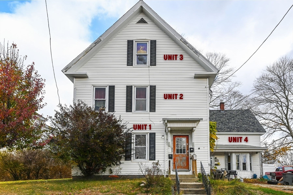 80-82 Maple Street Gardner, MA 01440 - Photo 1 of 4 a front view of a house with a yard