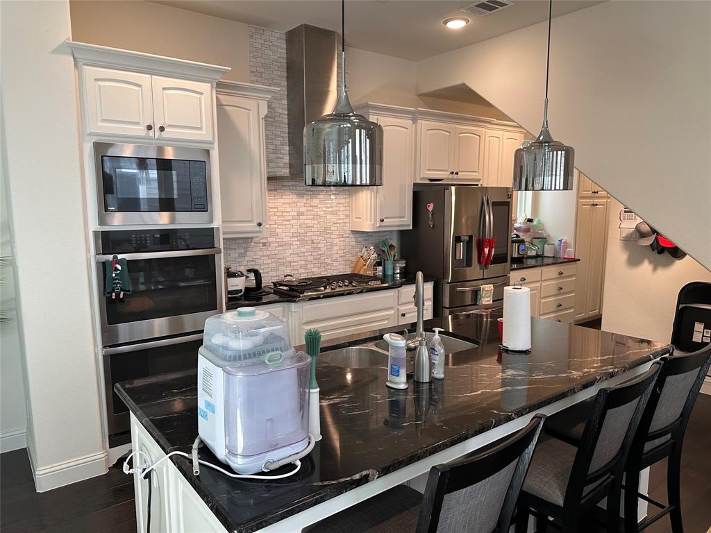 1037 Drew Lane Allen, TX 75013 - Photo 9 of 18 a kitchen with a sink appliances and cabinets