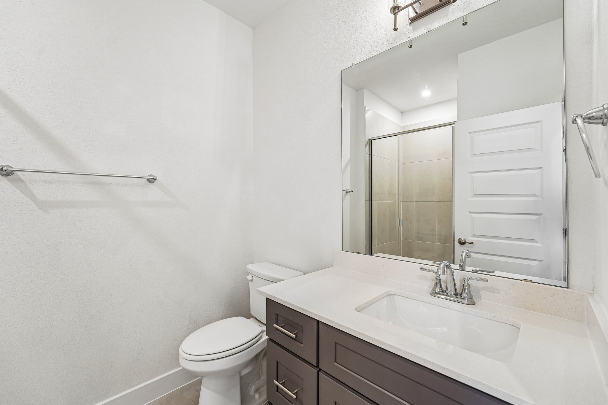 200 West 56th Street, Unit 2103 Austin, TX 78751 - Photo 17 of 26 The guest bathroom features a
quartz vanity and walk-in shower.