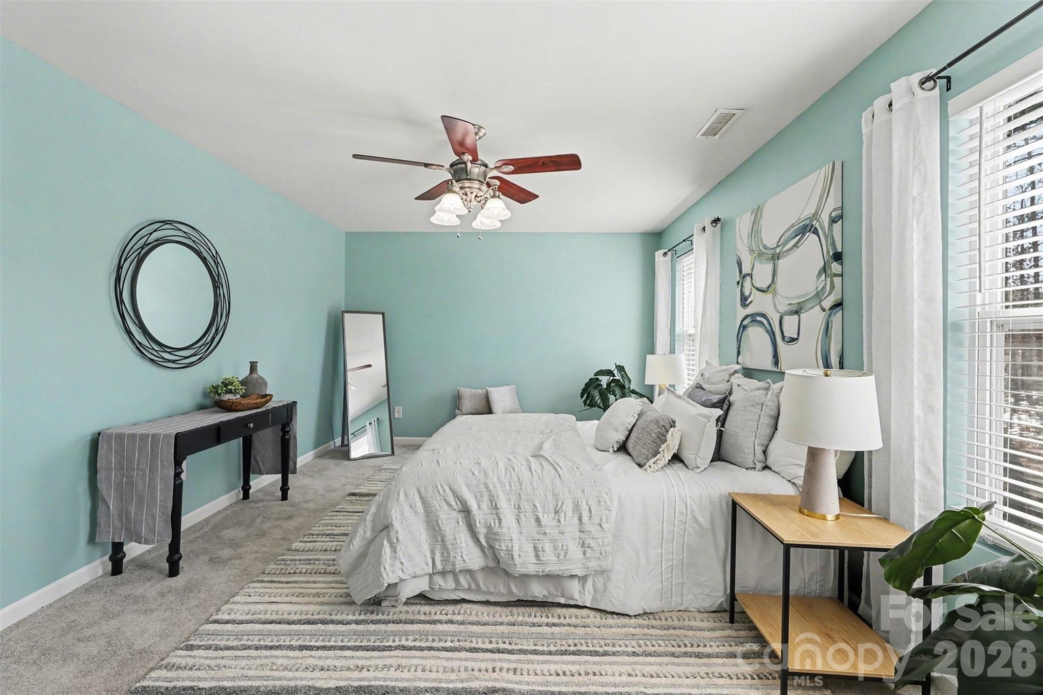 1806 Tradd Avenue Clover, SC 29710 - Photo 15 of 30 a bedroom with a bed and a chandelier