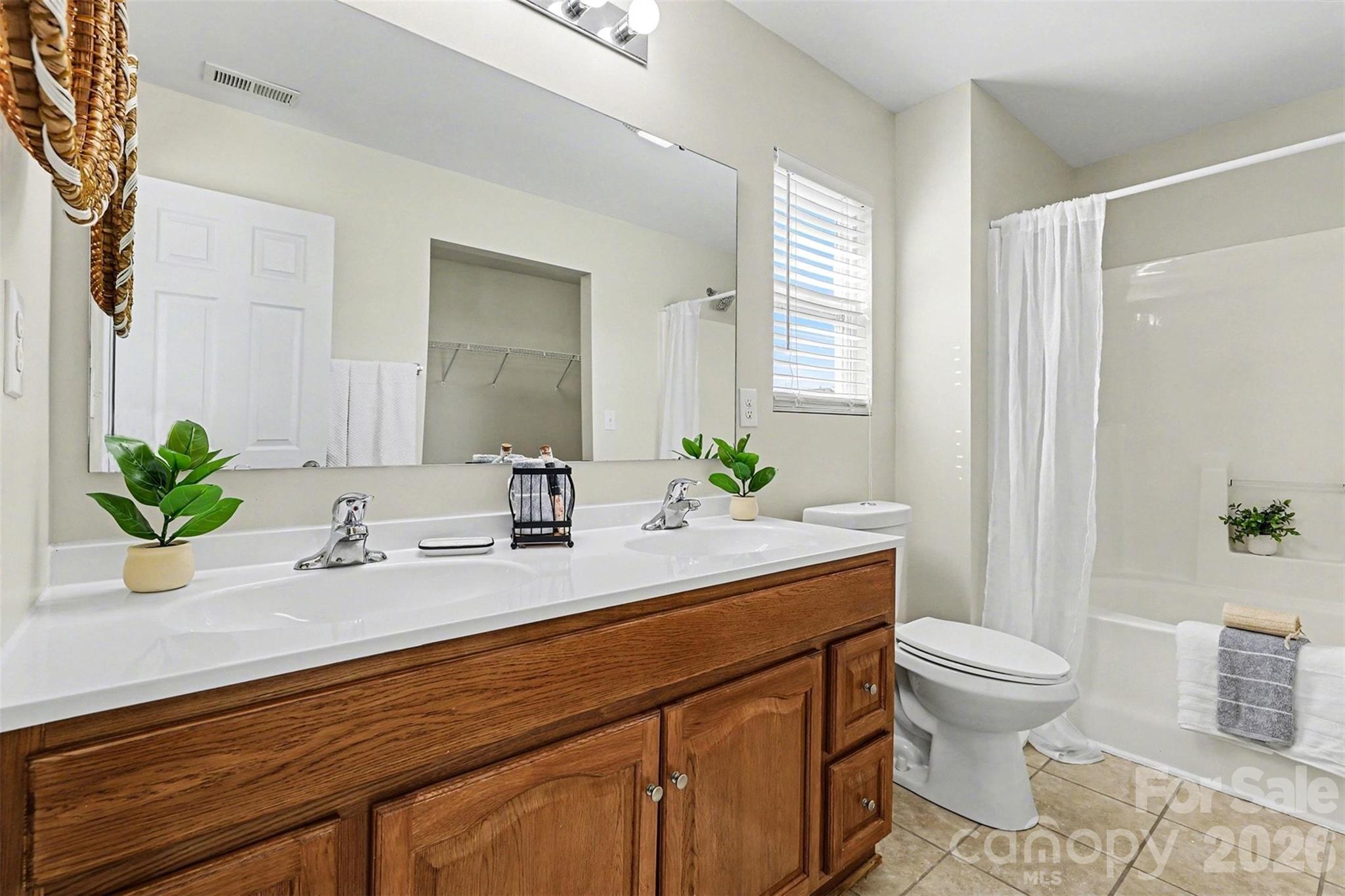 1806 Tradd Avenue Clover, SC 29710 - Photo 17 of 30 a bathroom with a sink a toilet and a mirror