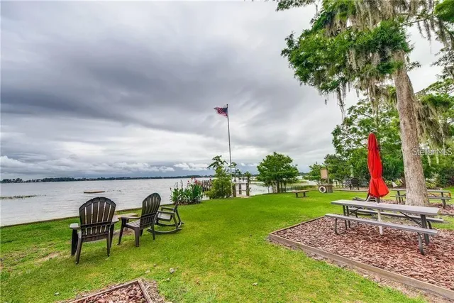 a view of a table and chairs in the garden