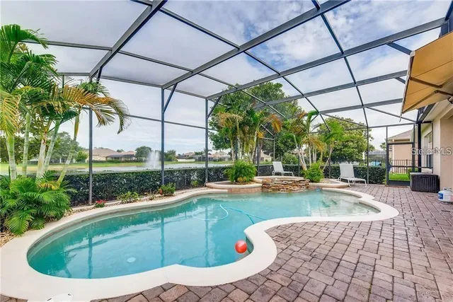 a view of a swimming pool with a porch