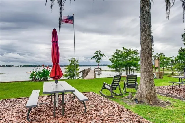 a view of a table and chairs in the garden