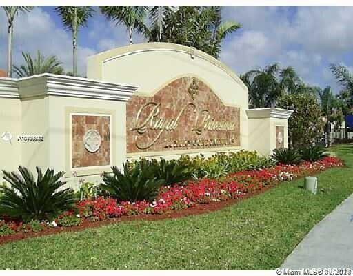 1239 Southwest 46th Avenue, Unit 906 Pompano Beach, FL 33069 - Photo 18 of 23 a view of a potted plant in front of a house