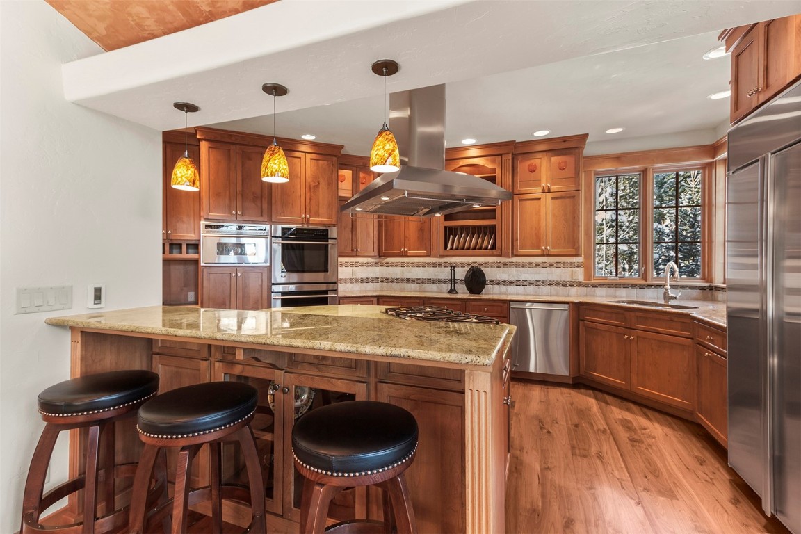 780 Penstemon Road Keystone, CO 80435 - Photo 6 of 40 a kitchen with kitchen island granite countertop a sink and a stove